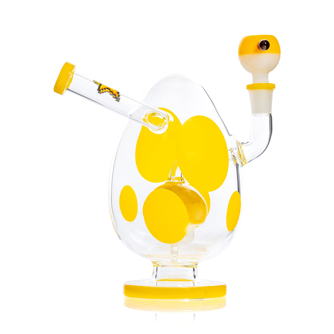 HEMPER Spotted Egg XL Bong, 9-inch yellow waterpipe with spotted design and clear glass base, side view on white background.