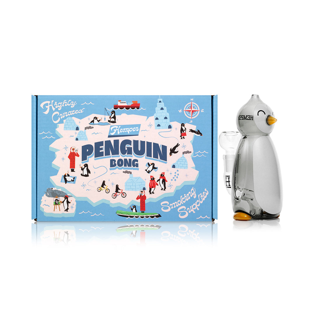Hemper Penguin Bong 6.2-inch glass bong with penguin design, clear glass, and box display on a white background.