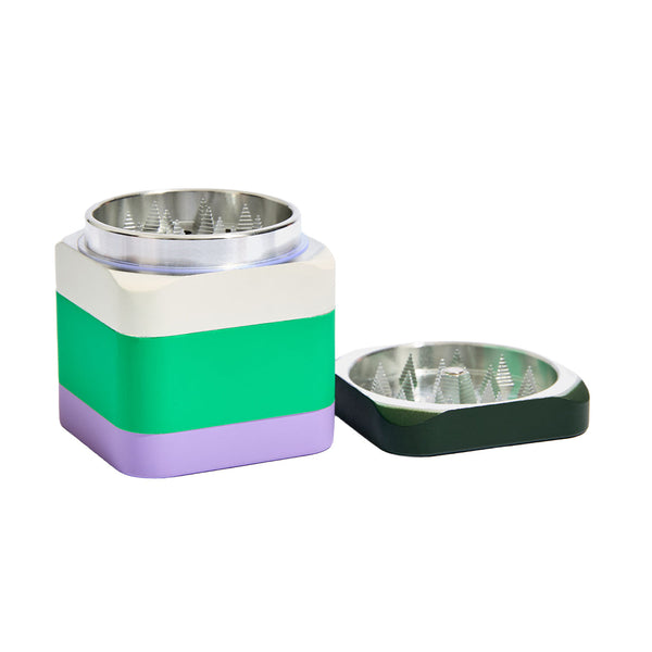 Edie Parker Colorblock Grinder with a vibrant algae green and multicolor design, featuring a sleek, modern style.