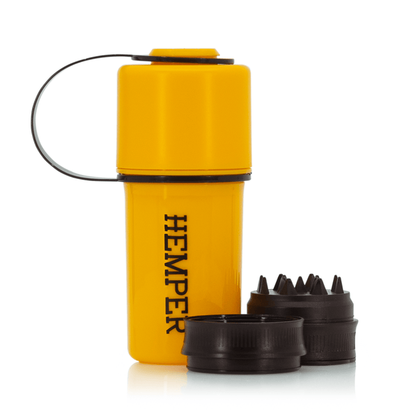 Hemper The Keeper™ yellow and black grinder with open lid, featuring a durable, compact design for herb grinding.