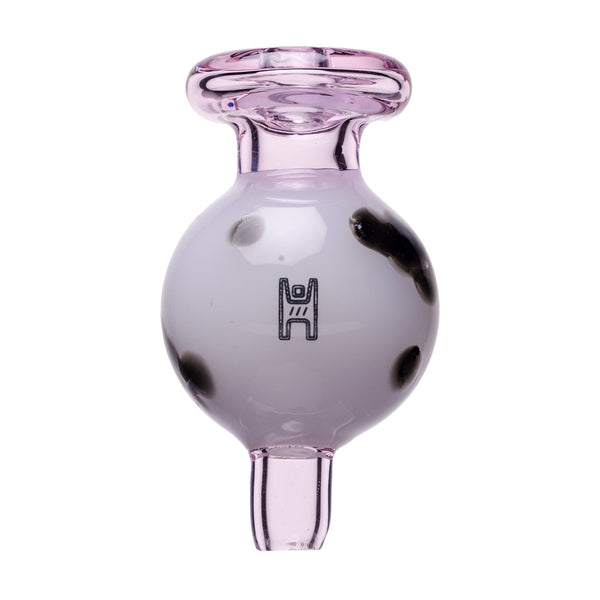 Human Grade glass carb cap with pink and white ball design featuring black spots for cannabis concentrate dabbing.