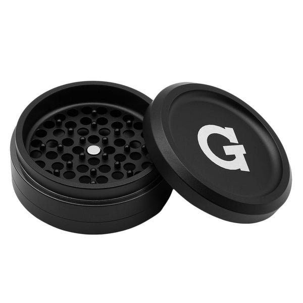 G Pen 3-piece slim grinder with compact design, metal construction, and textured grip for easy grinding of herbs.