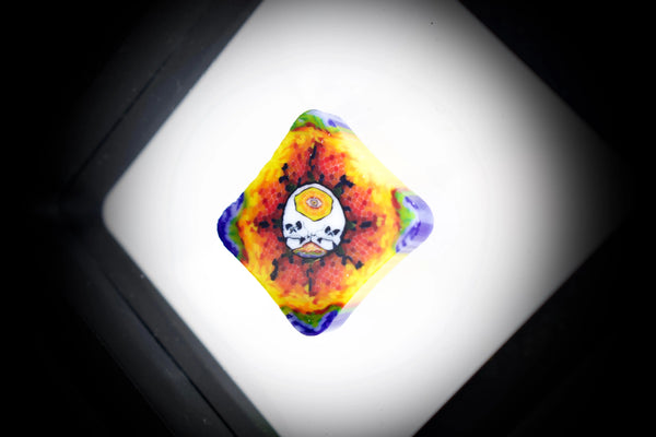 East Atlanta S&V AKM Glass Pipe Maker with tie-dye skull design, featuring vibrant colors and detailed craftsmanship.