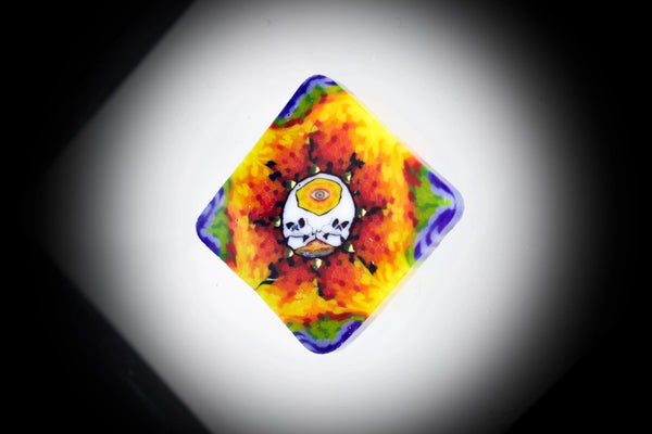 East Atlanta S&V AKM Glass Pipe Maker with tie-dye skull design, featuring colorful glass millie art and intricate details.