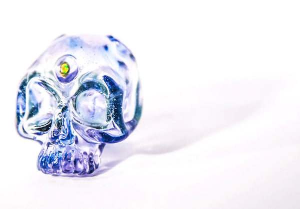 EAV Smoke & Vape Lucy Skull pendant featuring a detailed skull design, hanging from a chain, showcasing pendant jewelry style.
