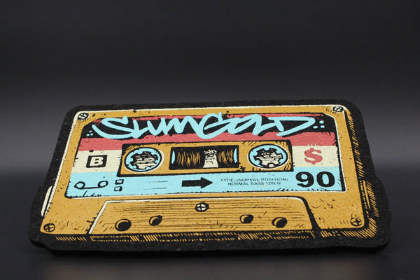 Moodmats X SlumGold "Mixtape" smoke accessories with vibrant, artistic design on a Moodmats brand mat, perfect for smoking sessions.