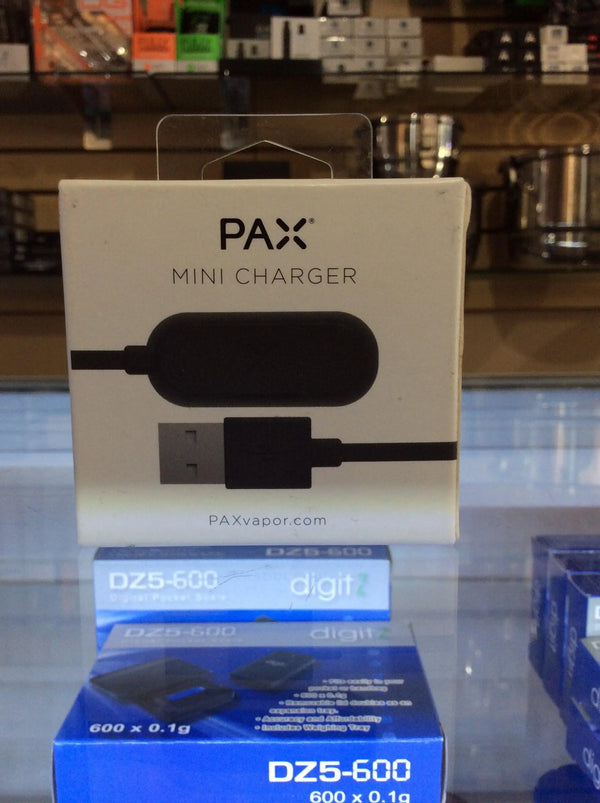 Pax Labs Pax Mini Charger for vape accessories, compact electronic charger shown with cable and charging port.