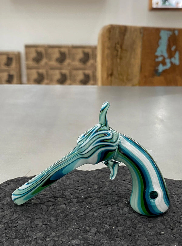 Piece Maker Glass line work revolver pipe, a clear glass pipe with detailed line patterns and a revolver-shaped design.