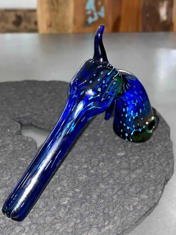 Piece Maker Glass Space Tech Revolver Pipe, a clear glass smoking pipe with a space-themed design and revolver shape, on a white background.