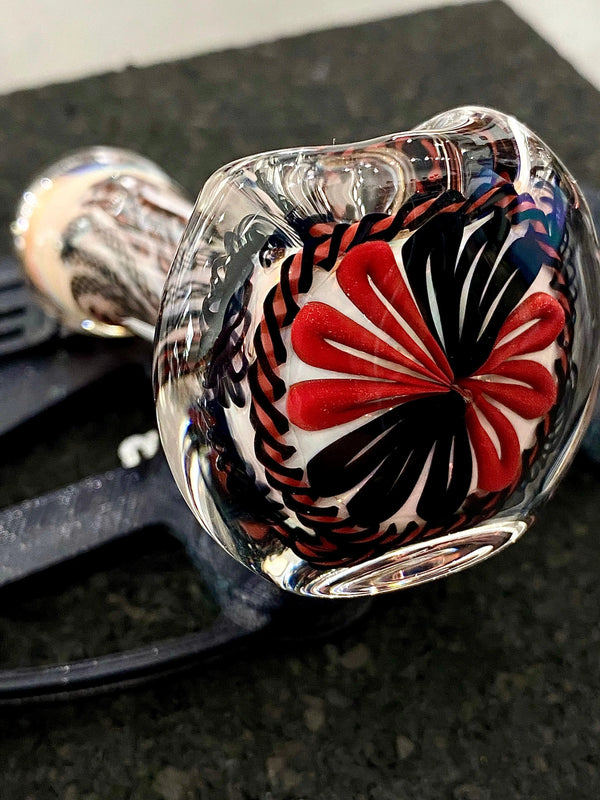 Talent Glass Works Inc detail cane glass pipe featuring a colorful, intricate design and smooth, rounded bowl shape.