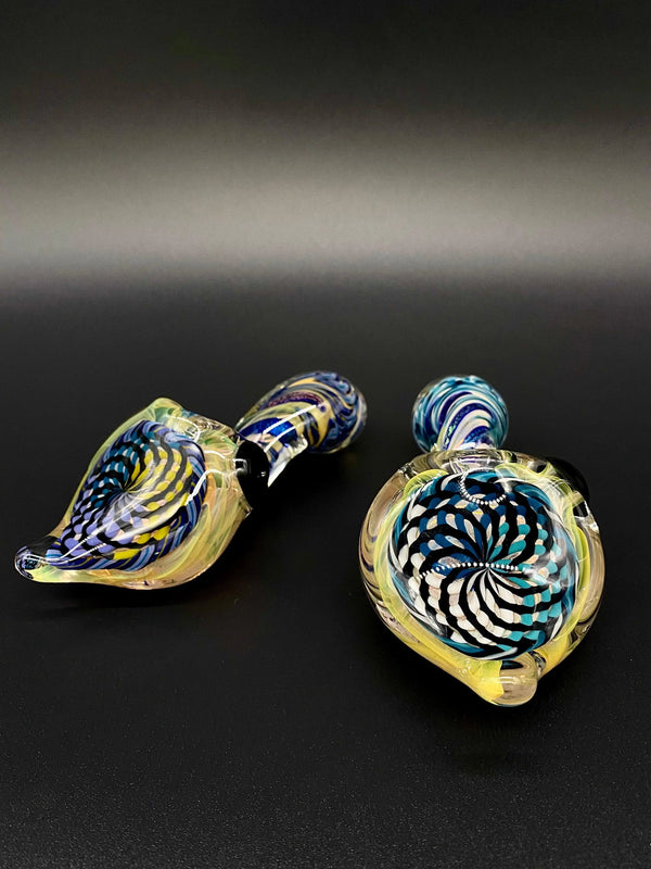 Talent Glass Works Inc. Reticello Sherlock glass pipe with dichroic stem, featuring intricate glasswork and vibrant colors.