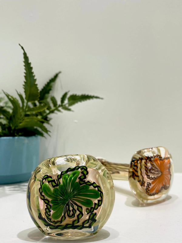 Talent Glass Works Inc glass pipe featuring a detailed cane strip spoon design with colorful glass accents.