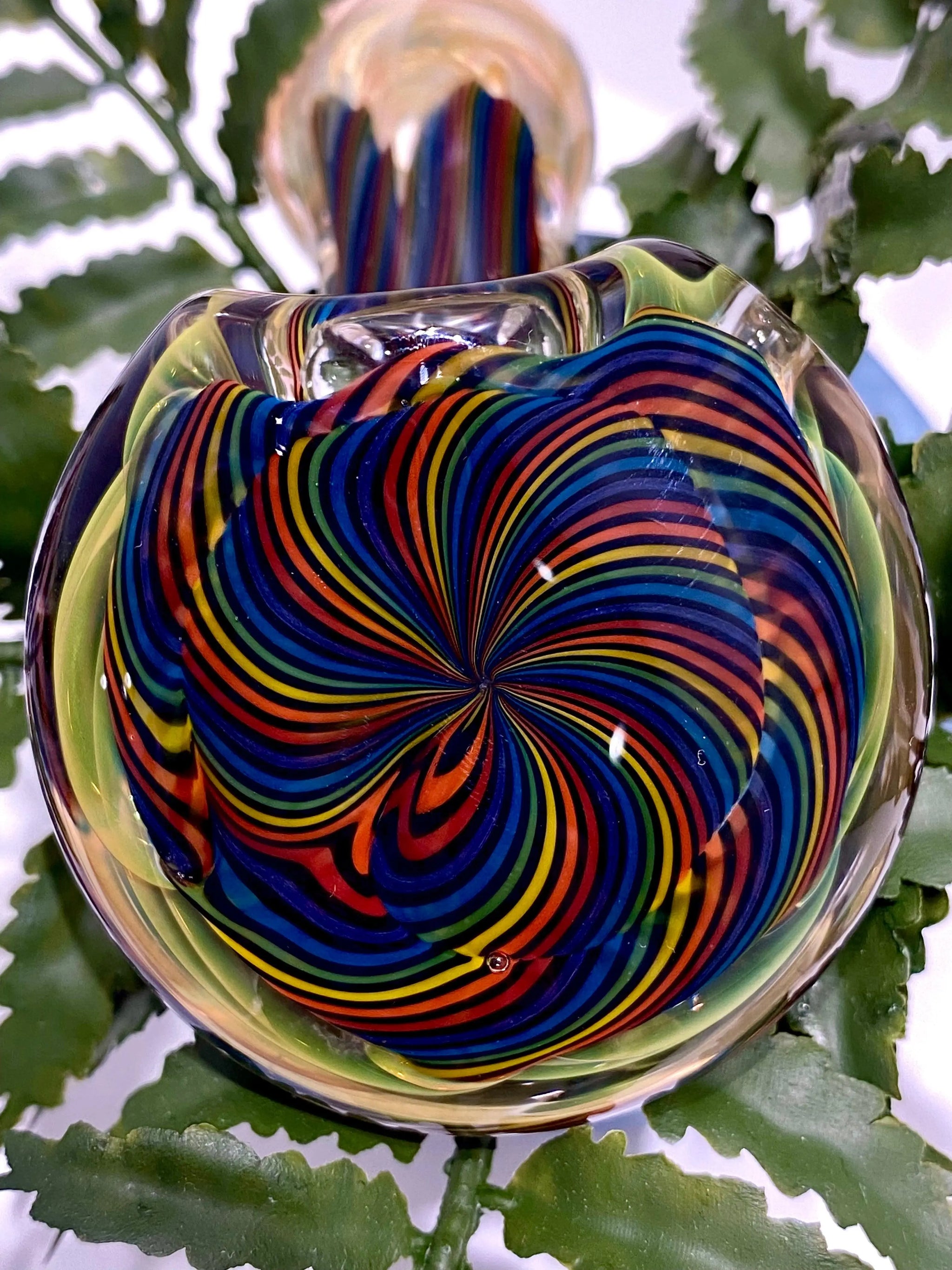 Color coil Sherlock glass pipe by Talent Glass Works Inc featuring vibrant swirling colors and a classic pipe design.