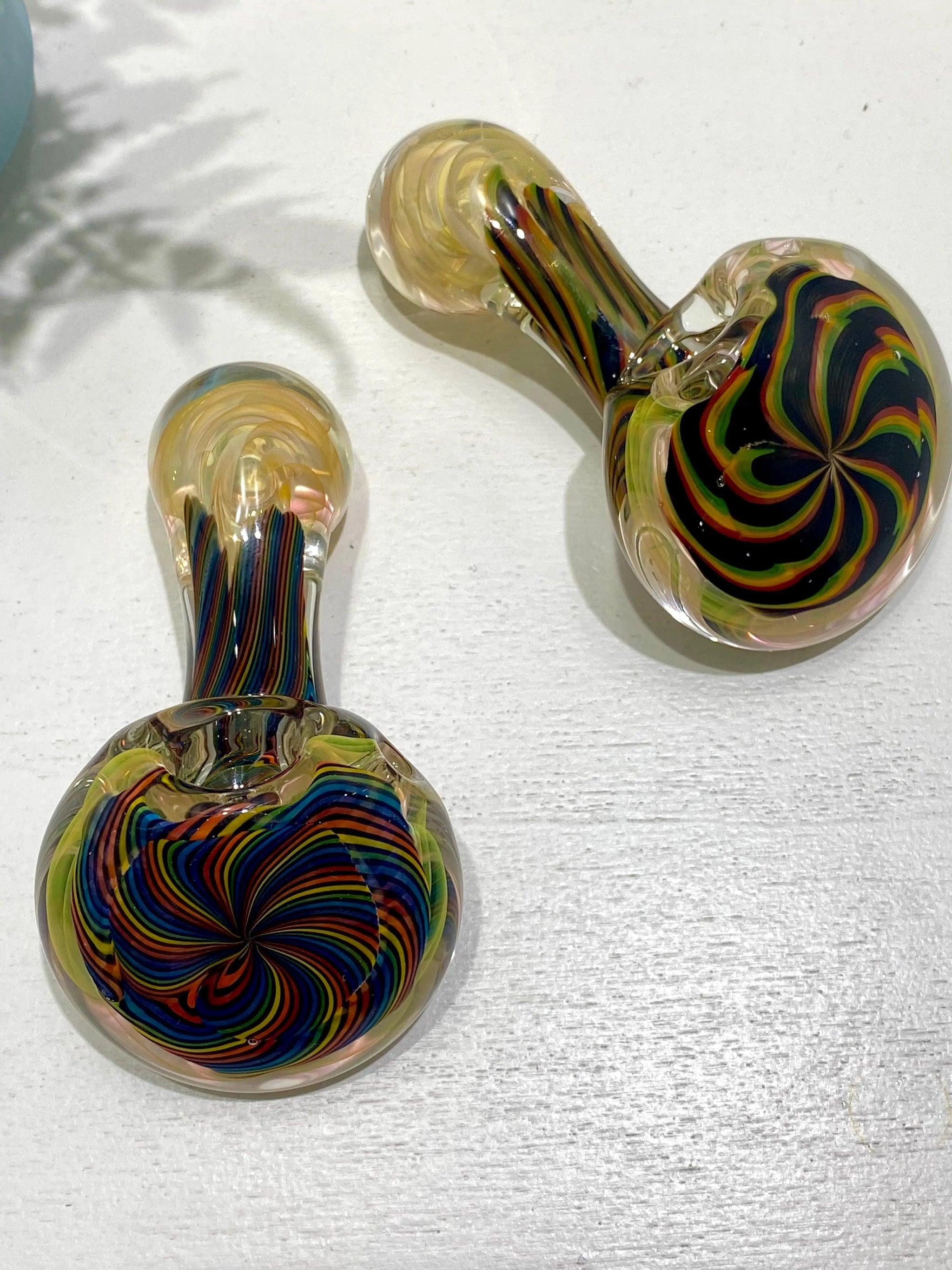 Color Coil Sherlock glass pipe by Talent Glass Works Inc, featuring a vibrant, twisted coil design and clear glass craftsmanship.