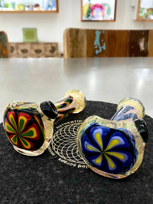 Color flower glass pipe by Talent Glass Works Inc featuring vibrant flower designs and clear glass construction.